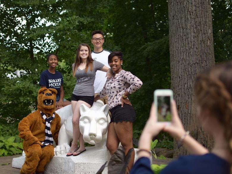 Students pose for a photo at the Lion Shrine